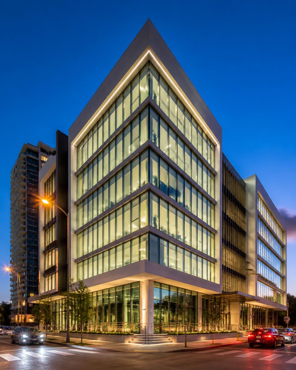 Modern Miami mid-rise office building at dusk with glass and concrete facade